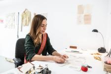 banff centre image of woman on desk (this is not a logo)